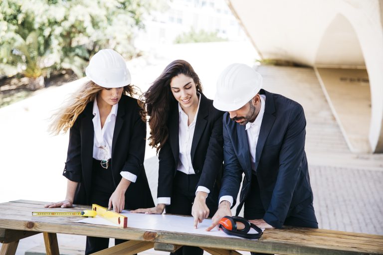 three-architects-with-plan-table