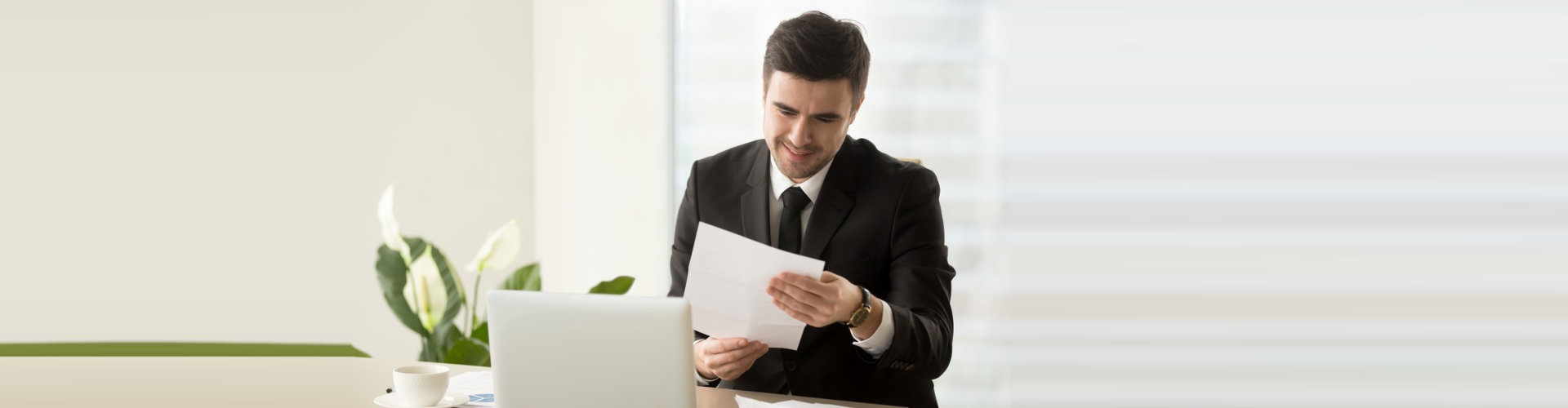 man looking at the paper