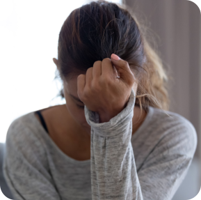 Woman experiencing a migraine