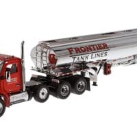A red and silver truck is parked next to the tanker.