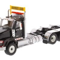 A black and silver truck with a sign on the side.