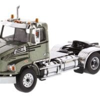 A green and white truck is parked in the road.