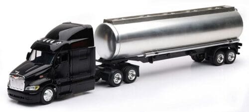 A toy semi truck with a trailer on the back.