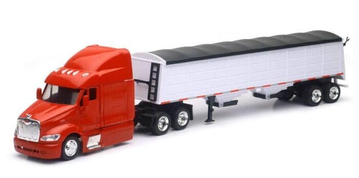 A red semi truck with a trailer on the back.