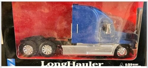 A long hauler truck is shown in its box.