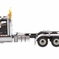A truck is parked on the side of the road.