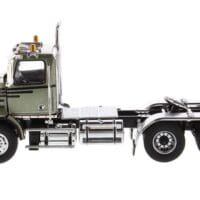 A truck is parked in the middle of the road.