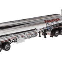 A silver semi truck with a long trailer.