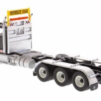 A truck with the cab and front end missing.
