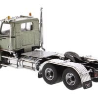 A truck is parked on the side of the road.