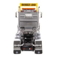 A large truck with the words " oversize load ".