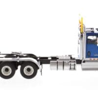 A blue and silver semi truck is parked.