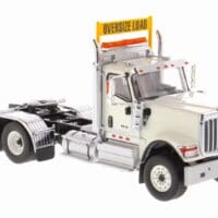 A white truck with an orange sign on the front.