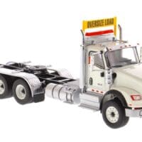 A white truck with a sign on the side of it.