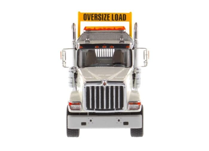 A large truck with the words " oversize load ".