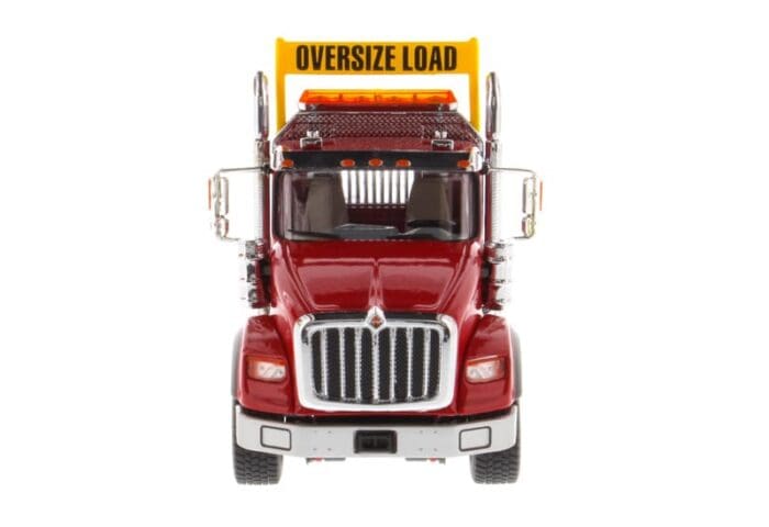 A red truck with the words " oversize load ".