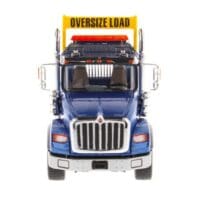 A large truck with an oversize load sign on the back.