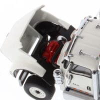 A white truck with its front end open.