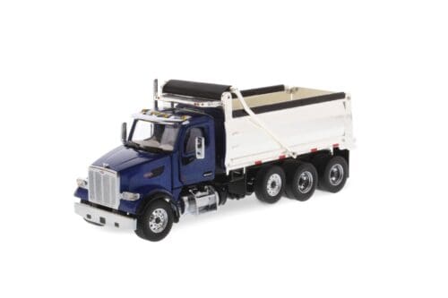 A blue dump truck with a white trailer.