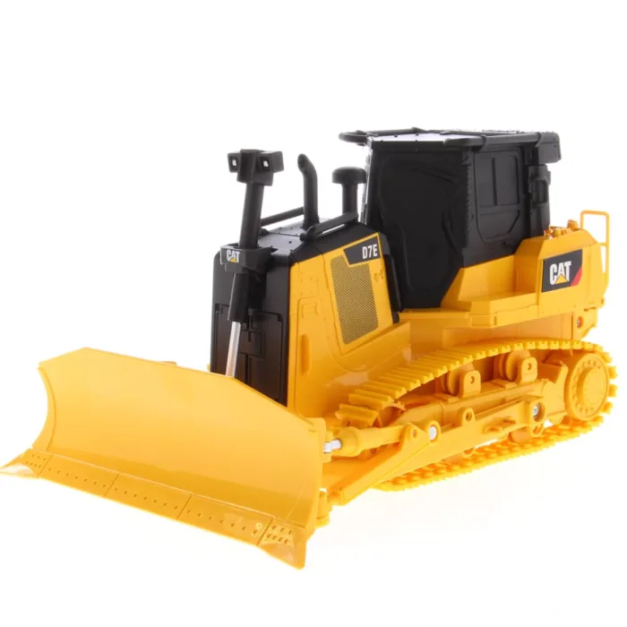 A yellow and black cat bulldozer is on the ground.