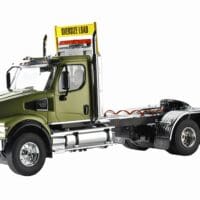 A green truck with a yellow sign on the side.